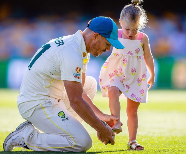 David Warner with daughter